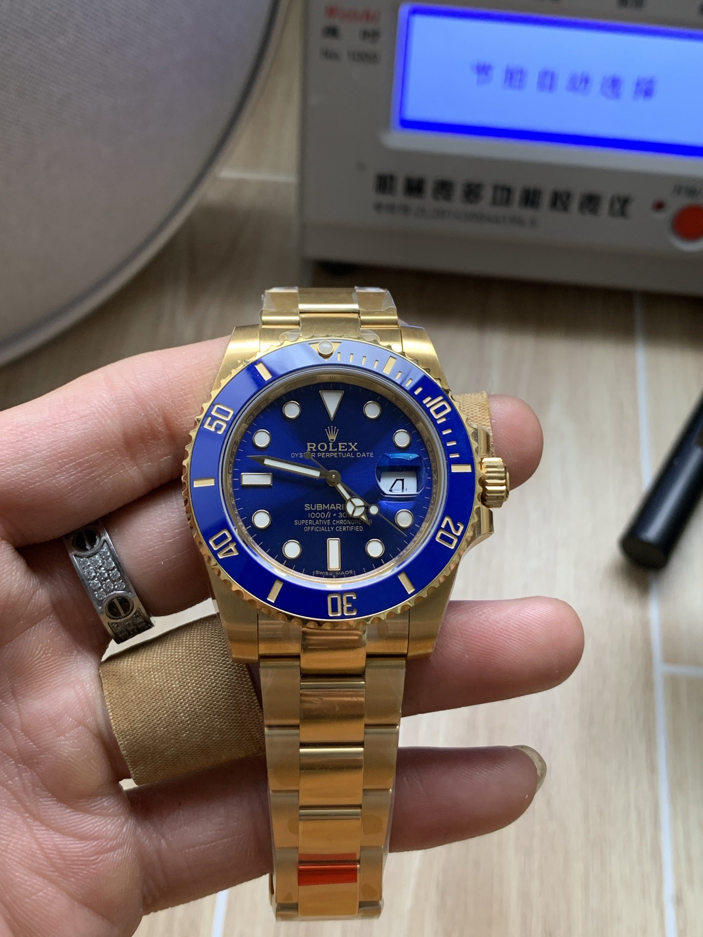 all-gold "Blue Submariner" (Ref. 3235 movement) featuring the latest-version green bezel